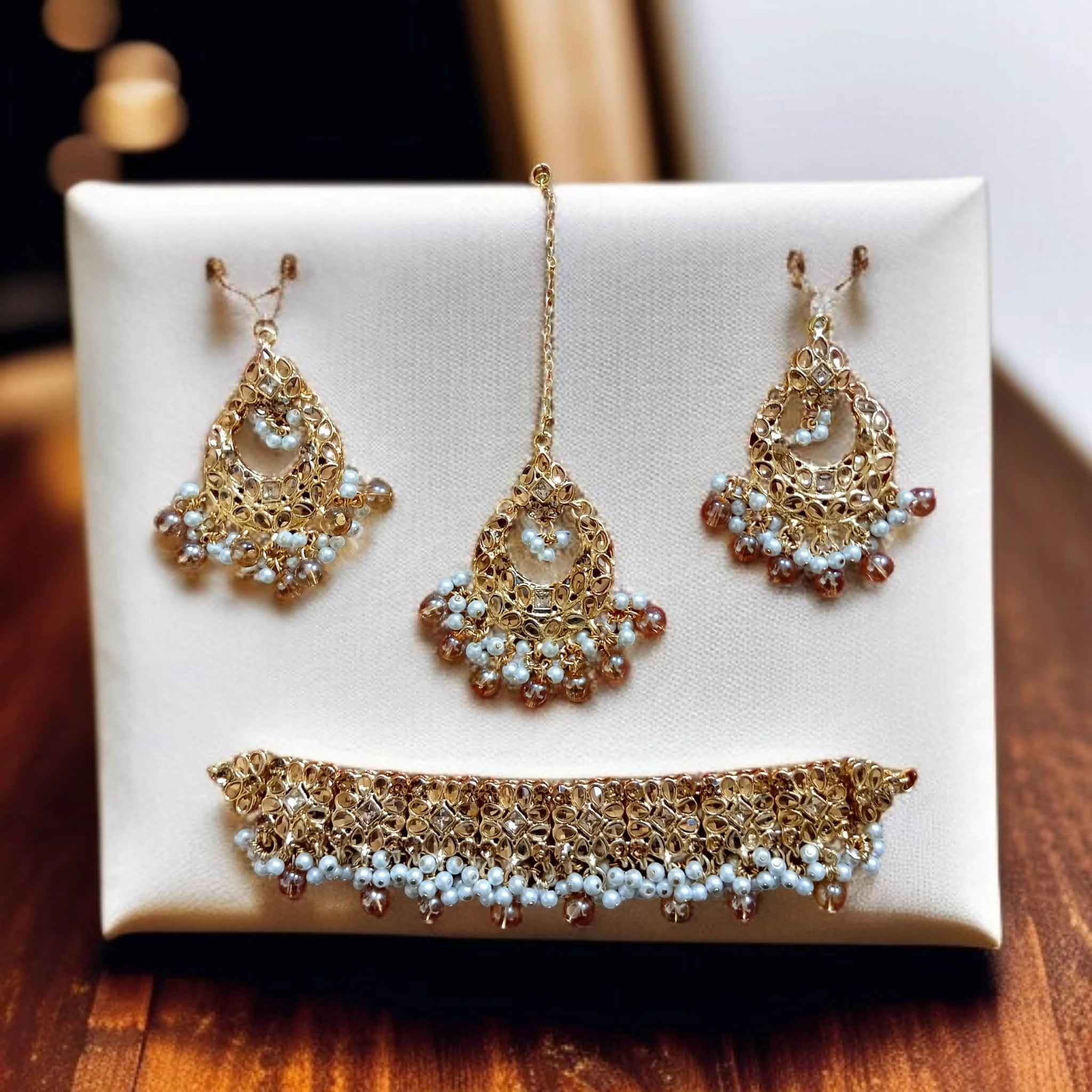 Buy Golden colour jewellery set with necklace , earrings and tikka at best price in pakistan